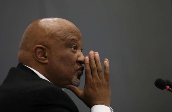 Former Deputy Finance Minister Mcebisi Jonas gestures ahead of the Judicial Commission of Inquiry probing state capture in Johannesburg