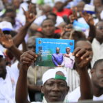 partisan-Coalition-opposition-tient-affichedes-photos-Laurent-Gbagbo-droite-Henri-Konan-Bedie-gauche-Abidjan-14-septembre-2019_0_1400_1045